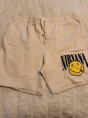 NIRVANA Cream Shorts with Yellow Smiley Graphic